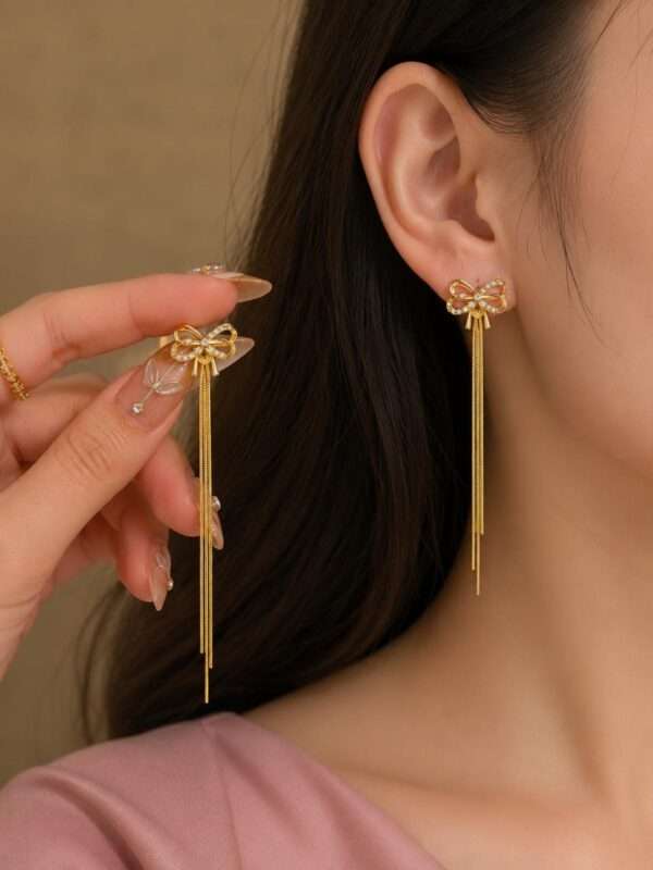 Golden Bow Tassel Earrings - Image 2
